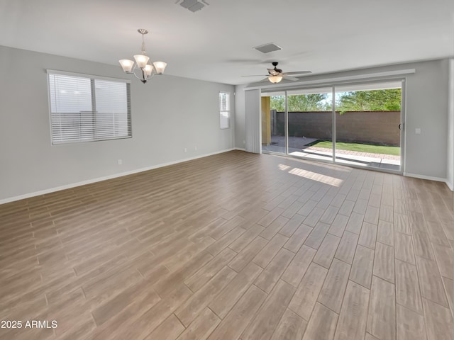 21081 W Almeria Rd, Buckeye, AZ 85396 - spare room with wood finished floors, visible vents, baseboards, and ceiling fan with notable chandelier