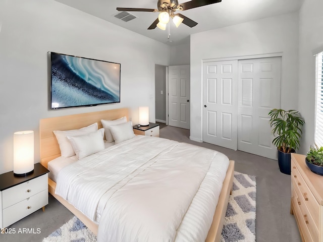21081 W Almeria Rd, Buckeye, AZ 85396 - carpeted bedroom with a ceiling fan, visible vents, and a closet