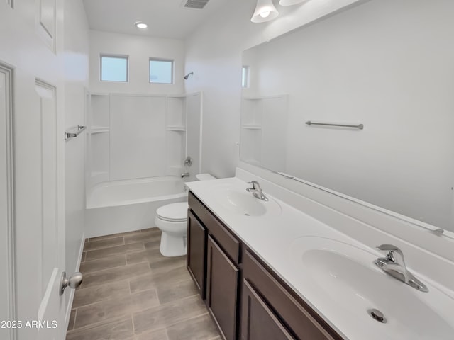 21081 W Almeria Rd, Buckeye, AZ 85396 - full bathroom with visible vents, a sink, double vanity, and toilet