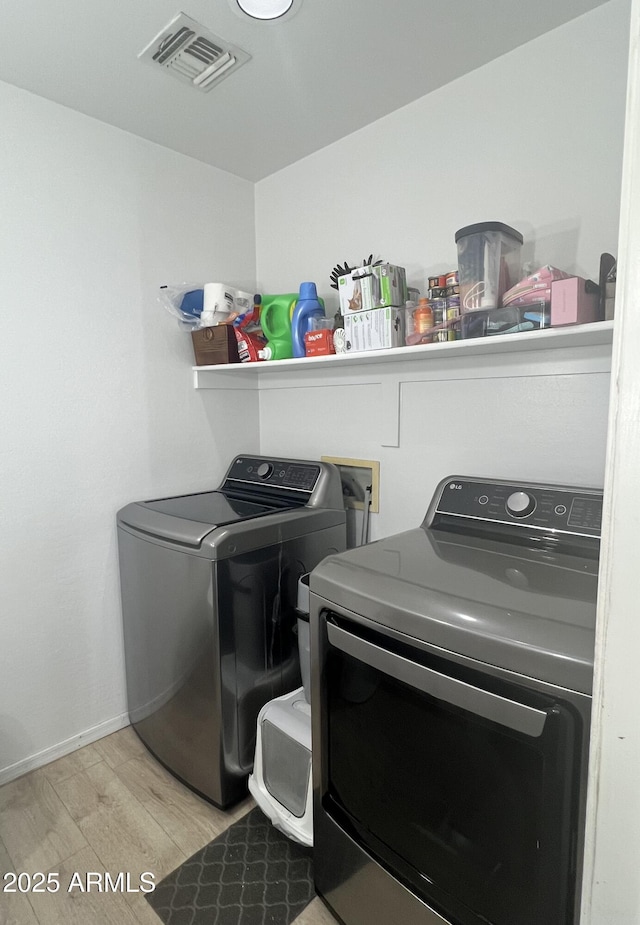 2311 E Hartford Ave Unit 38, Phoenix, AZ 85022 - laundry area with washing machine and clothes dryer and wood finished floors