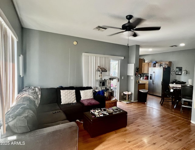 2311 E Hartford Ave Unit 38, Phoenix, AZ 85022 - living room featuring ceiling fan and light wood-style floors