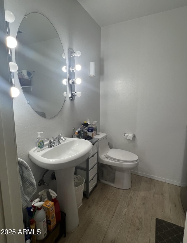 2311 E Hartford Ave Unit 38, Phoenix, AZ 85022 - bathroom with wood finished floors and toilet
