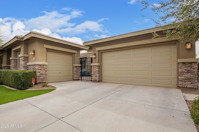 view of front of home featuring stucco siding, concrete driveway, an attached garage, a gate, and stone siding