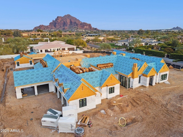 drone / aerial view featuring a residential view and a mountain view