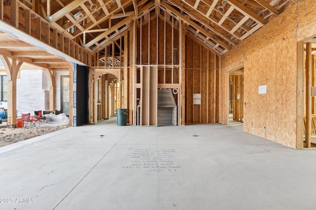 miscellaneous room with high vaulted ceiling