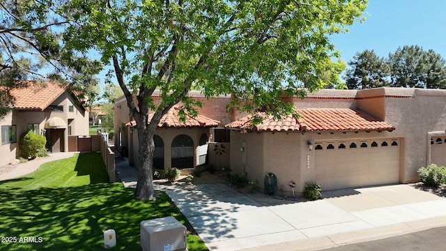 view of front of home featuring stucco siding, an attached garage, a tiled roof, driveway, and a front yard