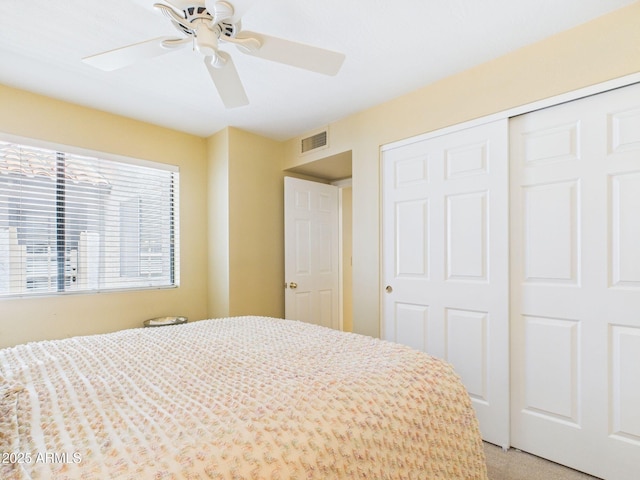 unfurnished bedroom featuring a closet, visible vents, and a ceiling fan