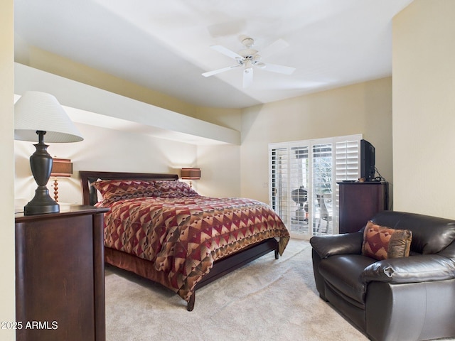 carpeted bedroom featuring a ceiling fan and access to outside