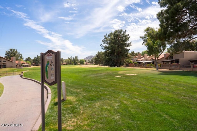 surrounding community with a yard