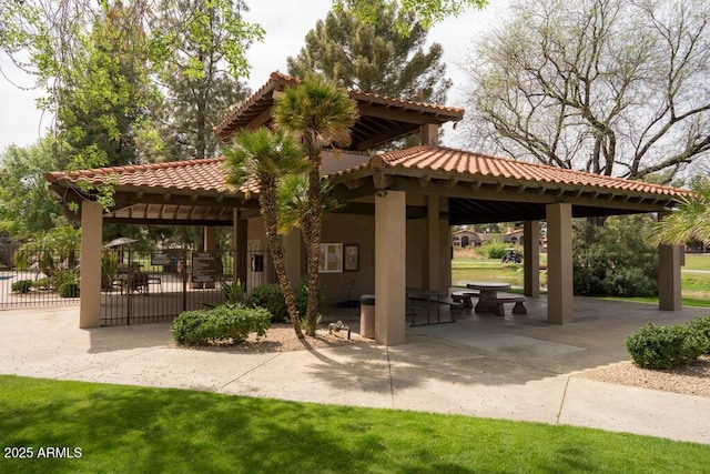 surrounding community with a gazebo and a patio area