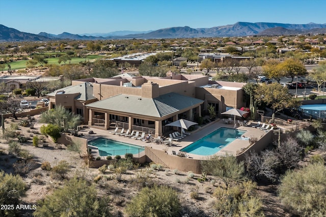 birds eye view of property featuring a mountain view