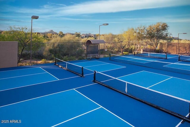 view of sport court with fence