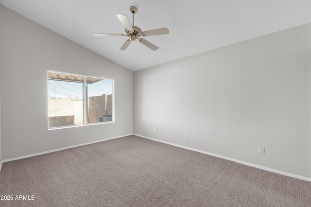 spare room with carpet floors, ceiling fan, and vaulted ceiling