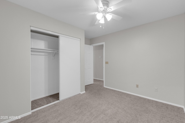 unfurnished bedroom featuring ceiling fan, carpet, and a closet