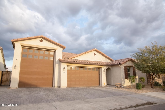 mediterranean / spanish-style home featuring a garage