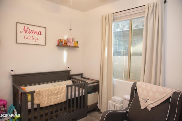 bedroom with a nursery area