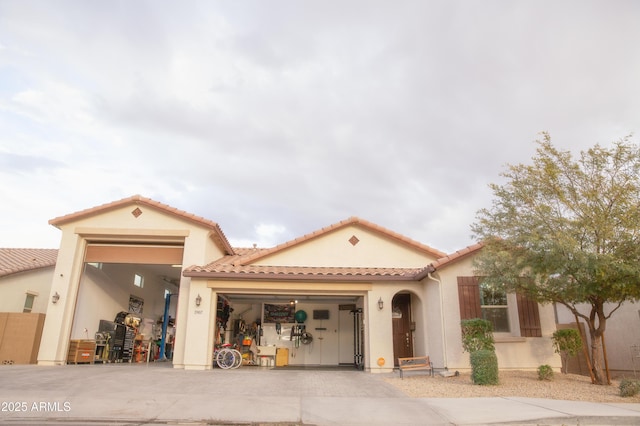 mediterranean / spanish house featuring a garage