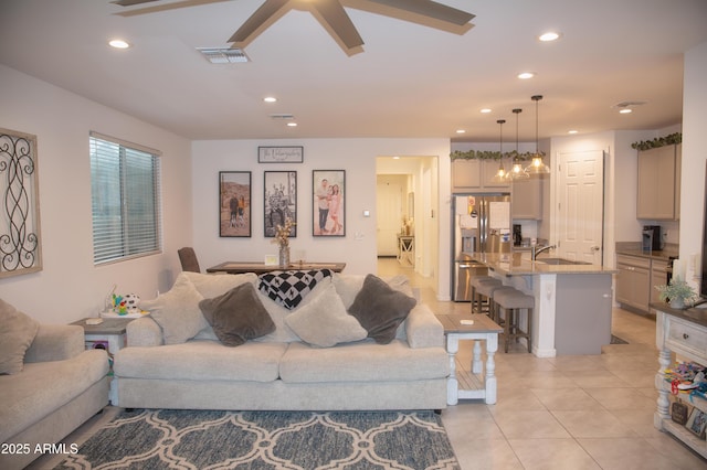 living room with sink and light tile patterned flooring