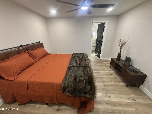 bedroom featuring baseboards, wood finished floors, a ceiling fan, and recessed lighting