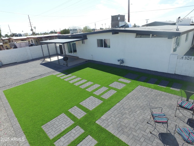 view of yard featuring a patio area, fence, and cooling unit