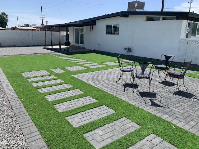 view of yard featuring a patio area and fence