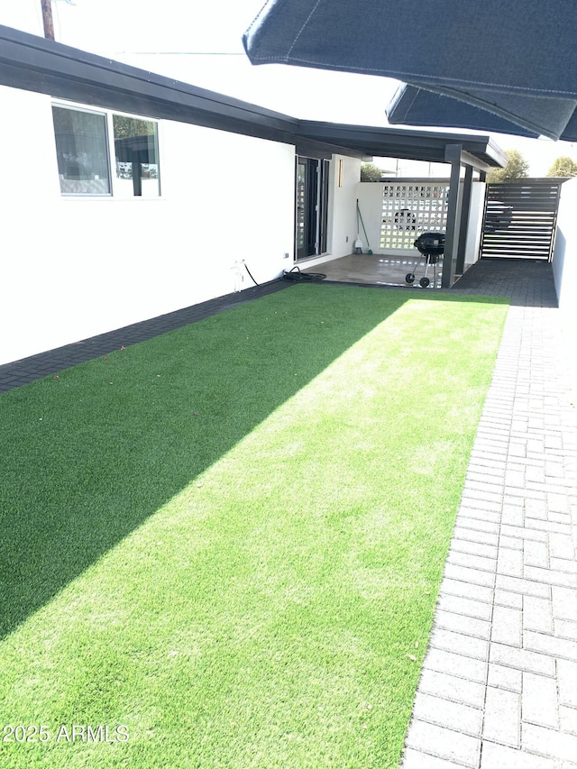 view of yard featuring fence