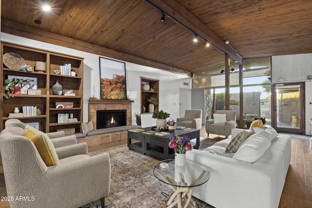 1522 W Myrtle Ave, Phoenix, AZ 85021 - living room with track lighting, wood finished floors, wooden ceiling, a tile fireplace, and built in features
