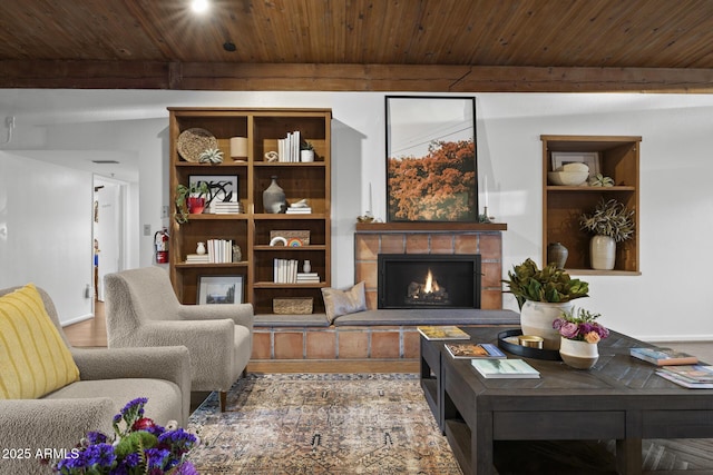 1522 W Myrtle Ave, Phoenix, AZ 85021 - living room with a wooden ceiling with exposed beams, wood finished floors, and a tile fireplace