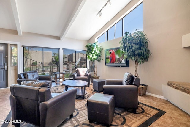 tiled living room featuring beam ceiling