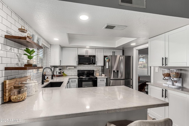 5302 W Poinsettia Dr, Glendale, AZ 85304 - kitchen with black range with electric cooktop, stainless steel fridge with ice dispenser, decorative backsplash, open shelves, and white cabinets