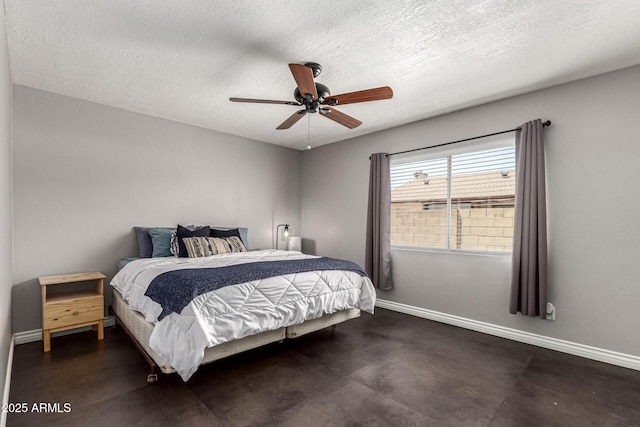 5302 W Poinsettia Dr, Glendale, AZ 85304 - bedroom with a textured ceiling, concrete flooring, and a ceiling fan