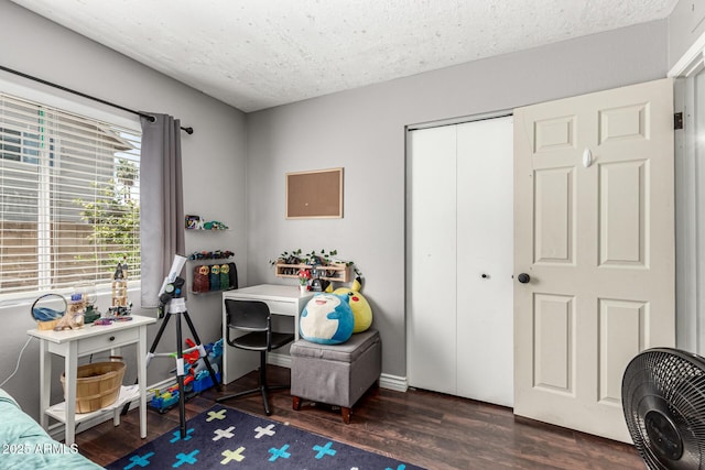 5302 W Poinsettia Dr, Glendale, AZ 85304 - bedroom featuring wood finished floors, a closet, and a textured ceiling