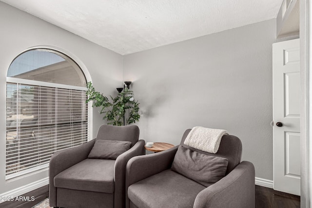 5302 W Poinsettia Dr, Glendale, AZ 85304 - sitting room with wood finished floors and baseboards