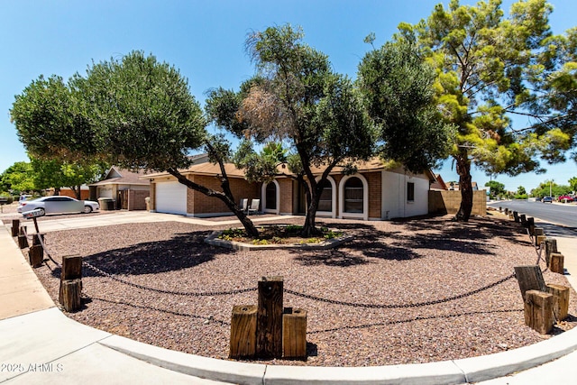 5302 W Poinsettia Dr, Glendale, AZ 85304 - view of front of property with brick siding, driveway, and a garage