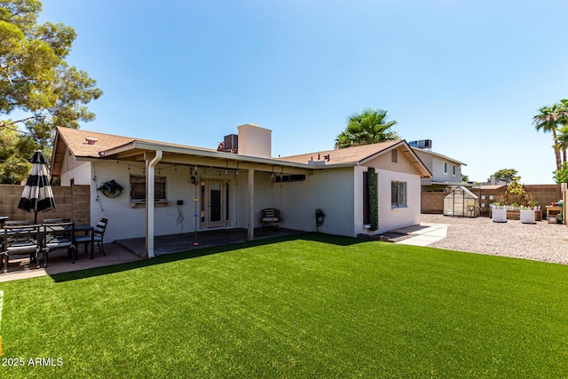 5302 W Poinsettia Dr, Glendale, AZ 85304 - back of house featuring a storage shed, a patio, and a fenced backyard