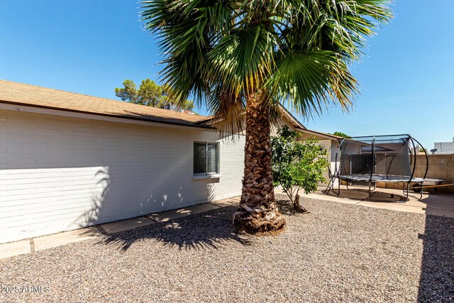 5302 W Poinsettia Dr, Glendale, AZ 85304 - view of yard featuring a trampoline