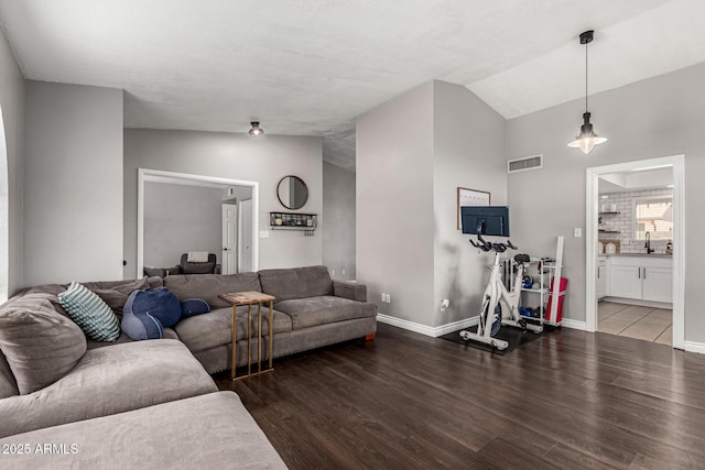 5302 W Poinsettia Dr, Glendale, AZ 85304 - living area featuring wood finished floors and lofted ceiling