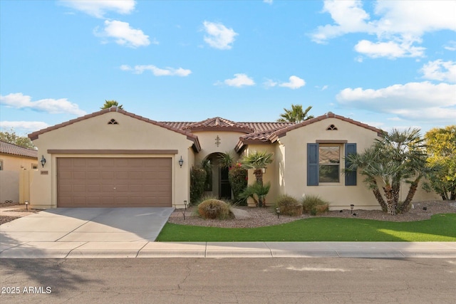 mediterranean / spanish house featuring a garage