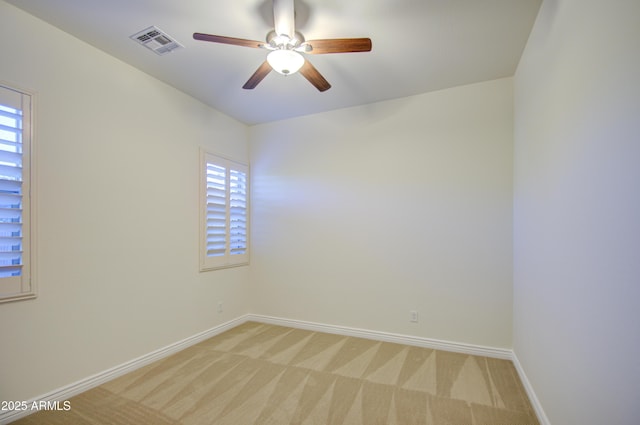 3753 E Ellis St, Mesa, AZ 85205 - unfurnished room featuring visible vents, a ceiling fan, baseboards, and light colored carpet