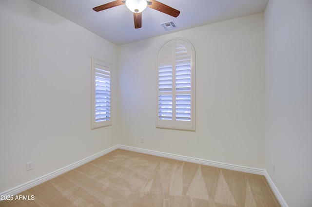 3753 E Ellis St, Mesa, AZ 85205 - spare room with carpet floors, ceiling fan, visible vents, and baseboards