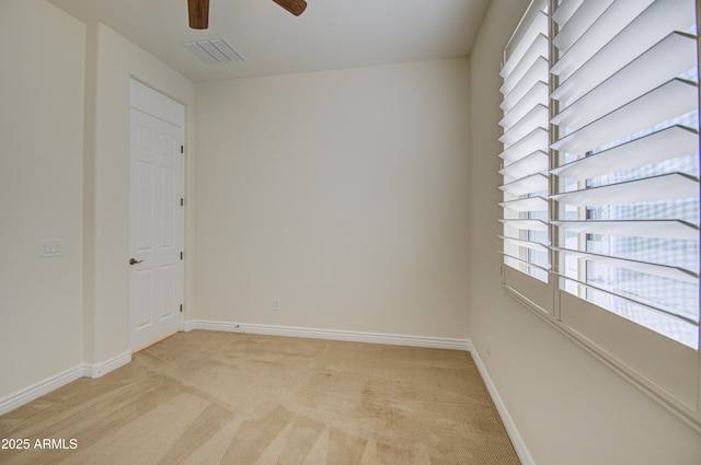 3753 E Ellis St, Mesa, AZ 85205 - unfurnished room with visible vents, a ceiling fan, baseboards, and light colored carpet