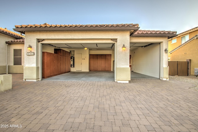 3753 E Ellis St, Mesa, AZ 85205 - view of front of house with a garage, a tiled roof, stucco siding, and decorative driveway