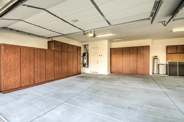 3753 E Ellis St, Mesa, AZ 85205 - garage featuring a garage door opener and water heater