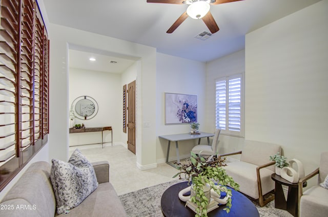 3753 E Ellis St, Mesa, AZ 85205 - living room with a ceiling fan, baseboards, and visible vents