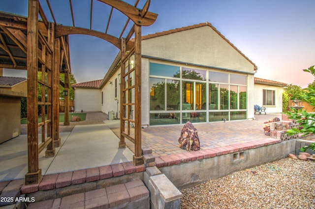 3753 E Ellis St, Mesa, AZ 85205 - back of house with a tiled roof, a patio, and stucco siding