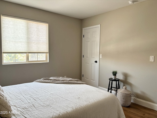 984 W Belmont Red Trl, San Tan Valley, AZ 85143 - bedroom featuring baseboards and wood finished floors