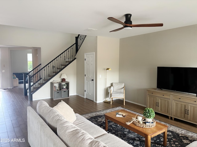 984 W Belmont Red Trl, San Tan Valley, AZ 85143 - living room featuring ceiling fan, stairway, dark wood finished floors, and baseboards