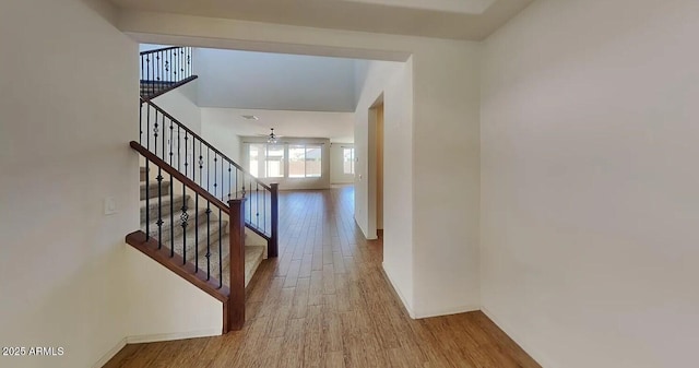 984 W Belmont Red Trl, San Tan Valley, AZ 85143 - hallway featuring wood finished floors, stairs, and baseboards