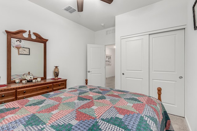 bedroom featuring a ceiling fan, light carpet, a closet, and visible vents