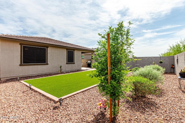 view of yard with a fenced backyard